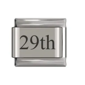 Detail of a stainless steel Italian modular charm with 29th engraved on the surface.