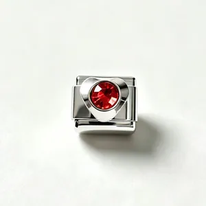 Macro view of a stainless steel heart-shaped Italian charm link with red zircon inlay