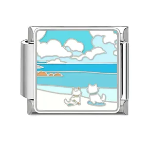 Macro detail of Italian modular charm link with cute cats beach enamel design