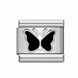 Detailed view of a silver Italian modular charm featuring a sleek black butterfly design