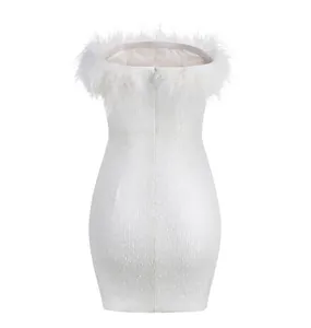 Close-up of white sequined bodycon dress with fluffy ostrich feather trim detail.