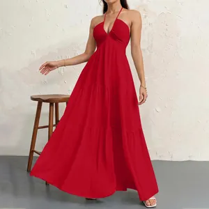 Elegant red halter neck tiered maxi dress featuring a ruched bodice and flowing skirt.