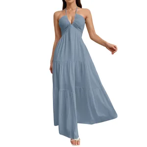 Detail of blue halter neck tiered maxi dress showing V-neckline and fabric texture