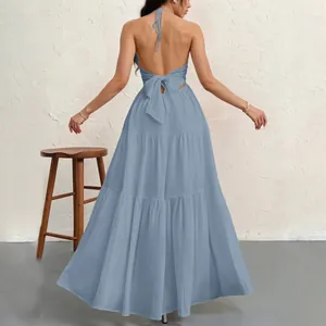 Detailed rear view of light blue halter backless tiered maxi dress with tie-back knot detail