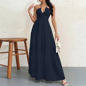 Elegant navy blue deep V-neck halter maxi dress featuring a tiered flowing skirt