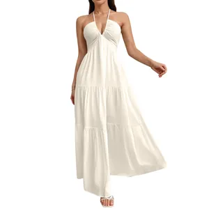 Detailed macro view showing the halter neck and tiered design of this white maxi dress
