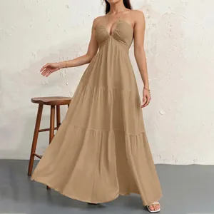 Detailed view of the khaki halter neck tiered maxi dress showing the ruffled fabric texture.