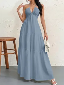 Elegant light blue halter neck tiered maxi dress featuring a chic backless design