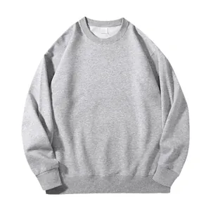 Minimalist heather grey crewneck sweatshirt featuring long sleeves and ribbed elastic cuffs