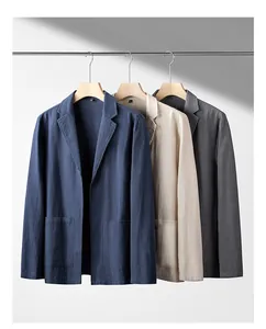 Lightweight men's linen blazers in navy, beige, and grey hanging on a rack