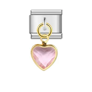 High-quality detail of a stainless steel Italian charm link featuring a pink heart pendant