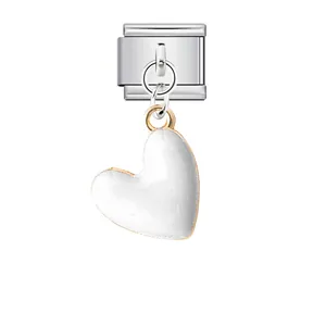 Close-up of a white enamel heart charm on a silver stainless steel Italian modular link.