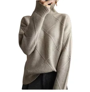 Detailed view of argyle diamond knit texture on soft beige turtleneck sweater
