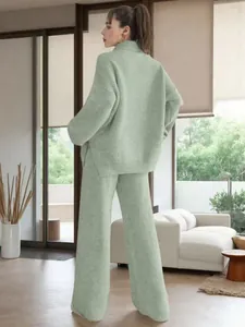 Detail back view of a sage green ribbed knit sweater and wide-leg lounge pants.