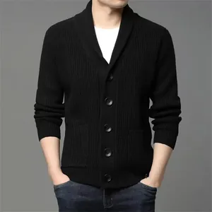 Close-up of a men's black thick knit cardigan with a shawl collar and button front