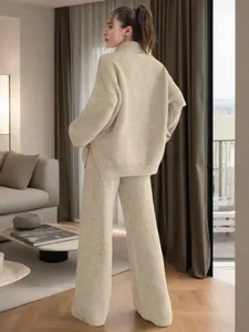 Back view of beige mock neck ribbed knit sweater and wide-leg pants lounge set