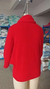 Back view of a cozy red high-neck knitted pullover featuring elegant lantern sleeves