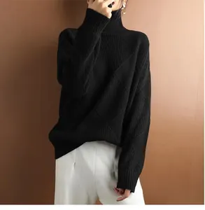 Elegant black turtleneck sweater featuring a subtle geometric diamond knit pattern texture