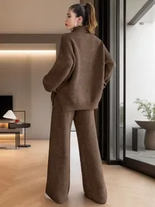 Back view of a cozy brown knitted turtleneck sweater and matching wide-leg pants set
