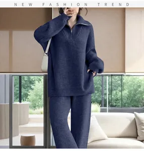Close-up of navy blue ribbed knit sweater with a stylish half-zip turtleneck collar