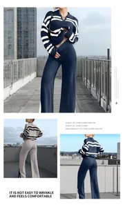 Detailansicht von gestreiftem Strickpullover und Weitbeinhose im Set
