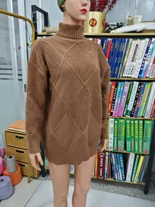 Close-up of brown turtleneck knit sweater with diamond pattern on mannequin