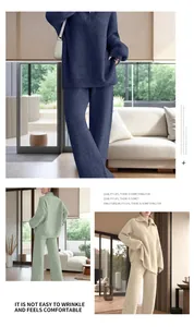 Detail view of women's zip-up knit sweater and wide-leg trousers set in three colors
