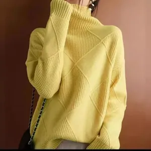 Yellow turtleneck argyle sweater with smooth knit texture for a fashionable look.