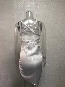 Back view detail of sexy white satin strappy midi dress with elegant lace-up tie design