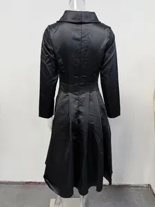 Back view detail of formal black long-sleeved satin dress with waist cinching