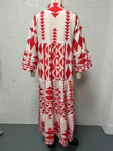 Back view detail of bohemian maxi dress with vibrant red geometric print patterns