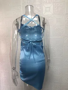 Back view of light blue satin dress featuring sexy cross-back tie-up straps