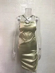 Elegant champagne gold satin slip dress featuring a glossy finish on a mannequin.