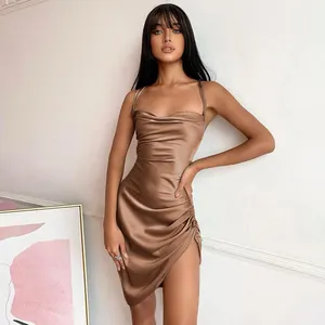 Elegant brown satin slip dress featuring a stylish side slit and ruched detail on model