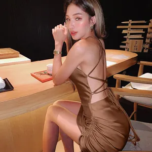Sexy brown satin backless dress with lace-up detail and side ruching on Asian model