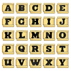 Detail of golden Italian modular charms with bold black A-Y alphabetical letters