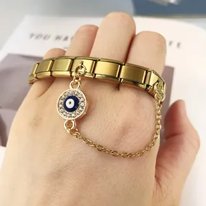Gold-plated stainless steel evil eye charm bracelet featuring modular DIY link design