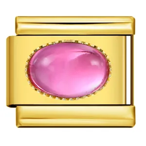 Macro detail of a gold-plated stainless steel Italian modular charm with pink oval stone