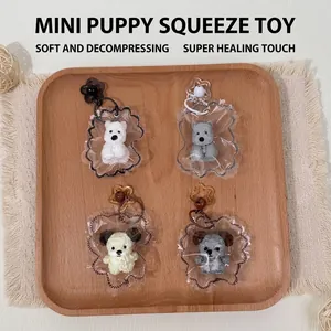 Set of four mini West Highland Terrier squishy toys displayed on a rustic wooden tray
