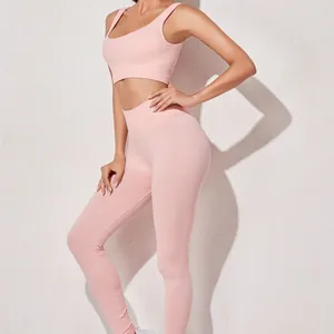 Roze geribbelde yoga-set met hoge elasticiteit, sportbeha en legging