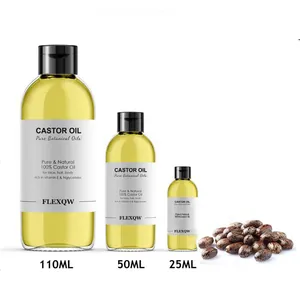 Trois flacons d'huile de ricin biologique pure de différentes tailles avec des graines.