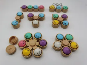 Collection of colorful steamed bun fidget toys in various multi-slot designs and keychains.