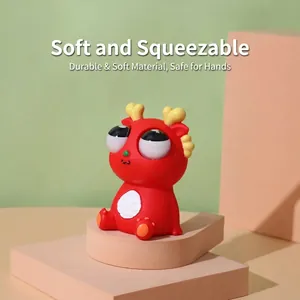 Simpatico drago rosso squishy con buffi occhi a sbalzo per gioco antistress relax