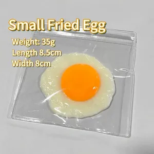 Detailed macro shot of realistic simulation fried egg squishy toy in plastic bag