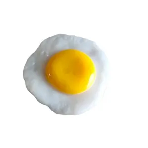 Realistic fried egg squishy toy for stress relief with a soft texture on white background