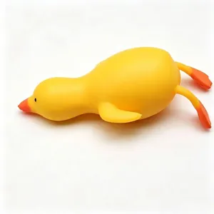 Close-up macro detail of a large yellow duck squishy toy for stress relief on white