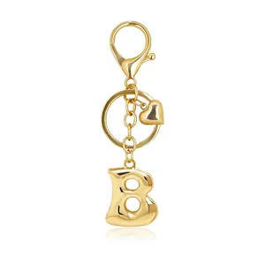 Gold bubble letter B keychain with heart charm and lobster clasp for bag accessory