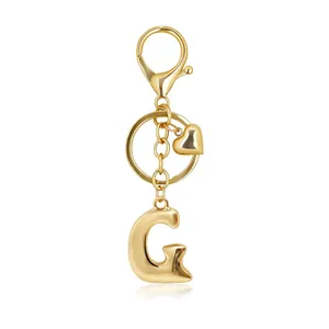 Elegant golden alphabet G keychain featuring a heart charm and secure lobster clasp
