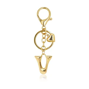 Elegant gold bubble letter U keychain featuring a heart charm and lobster clasp