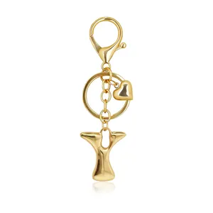 Detailed view of a golden bubble letter Y keychain featuring a heart charm and clasp